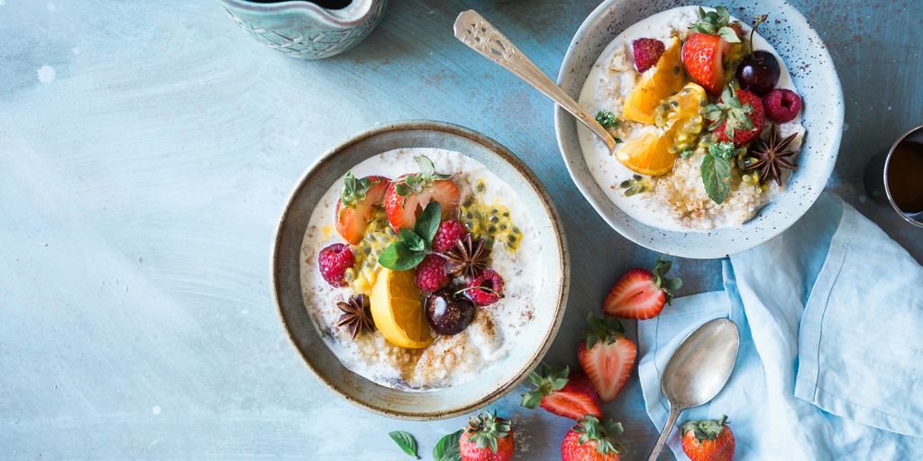 two bowls of oatmeal with fruits